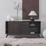 Dark wood sideboard with decorative items in a room setting
