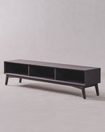 Dark wood TV stand on a light gray background