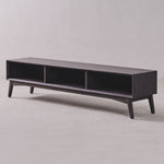 Dark wood TV stand on a light gray background