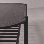Dark wooden chair with a simple design on a neutral background