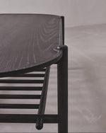 Dark wooden chair with a simple design on a neutral background