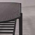 Dark wooden chair with a simple design on a neutral background