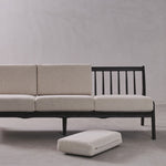 Sofa with ottoman on a plain background