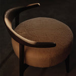 Brown chair with a dark background