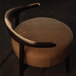 Brown chair with a dark background