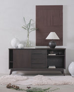 Dark wood sideboard with decorative items in a room setting