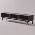 Dark wood TV stand on a light gray background
