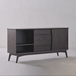 Dark wooden sideboard with open shelves and closed doors on a light gray background