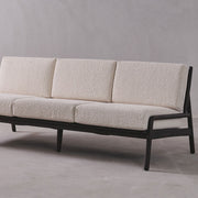 Beige sofa with black frame on a gray background