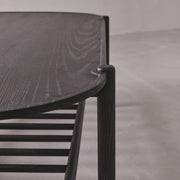 Dark wooden chair with a simple design on a neutral background