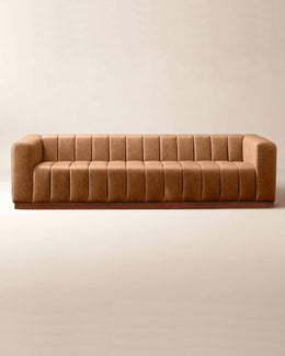 Brown sofa on a beige background