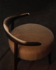 Brown chair with a dark background